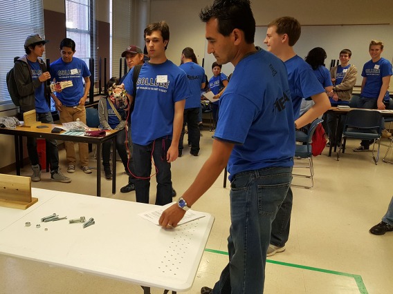 MESA Alum assisting with Prosthetic Arm Competition